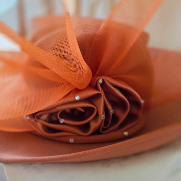 NIB Tania Bella burnt orange hat, with satin rose and mesh, gems